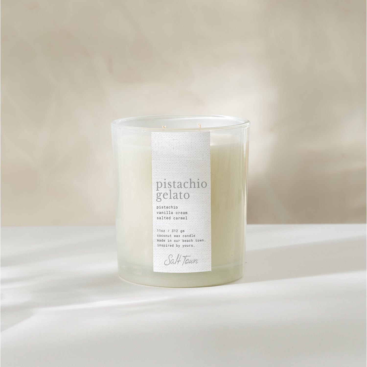 Candle labeled &
