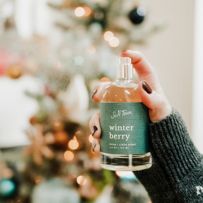 Hand holding a bottle of &